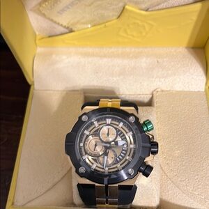 Invicta Gold and Black Watch with Green Accent